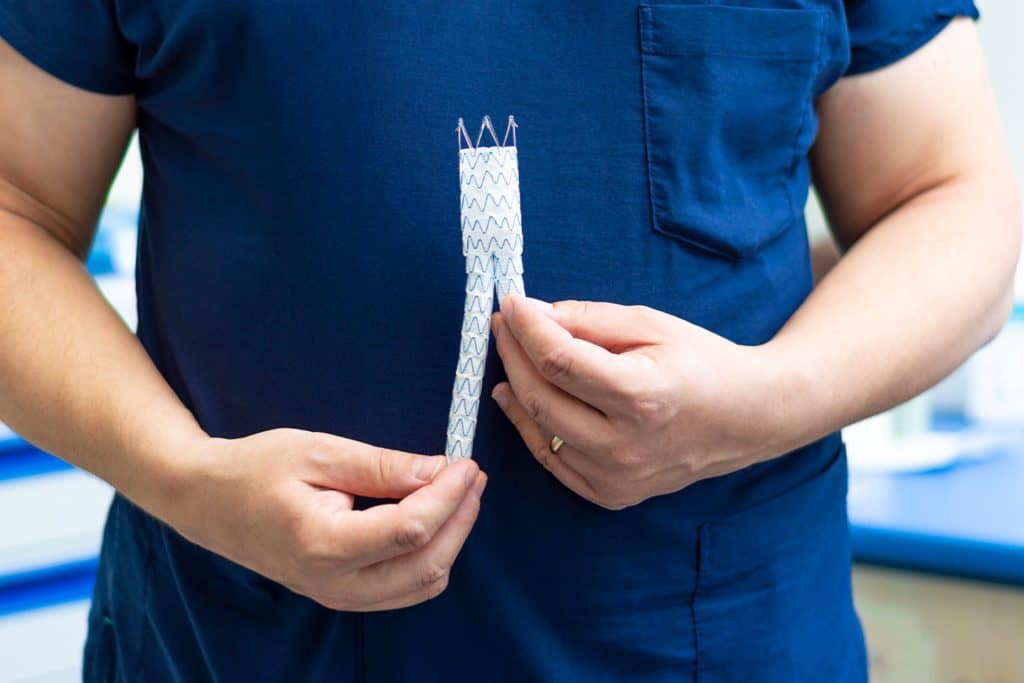 doctor holding a stent