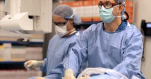 Two surgeons performing a procedure