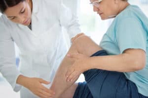 doctor checking out peripheral arterial disease in a patient