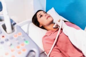 Mid adult woman on ultrasound exam at hospital