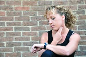 woman holding neck
