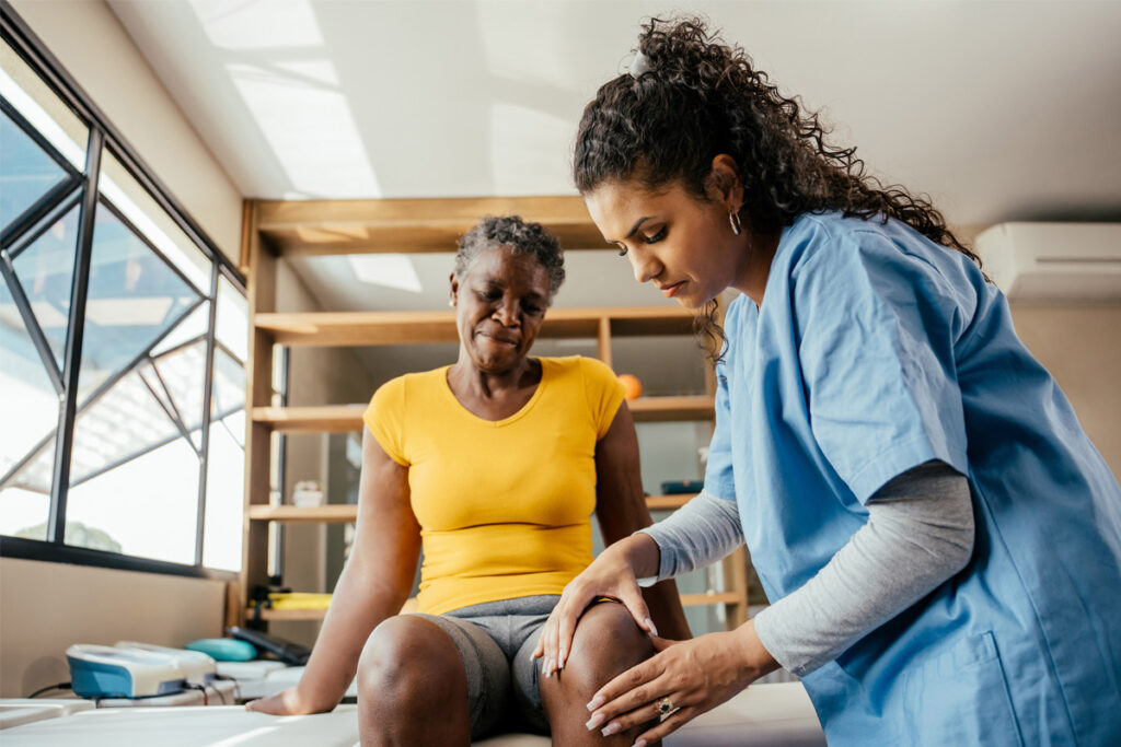 doctor treating patient's leg