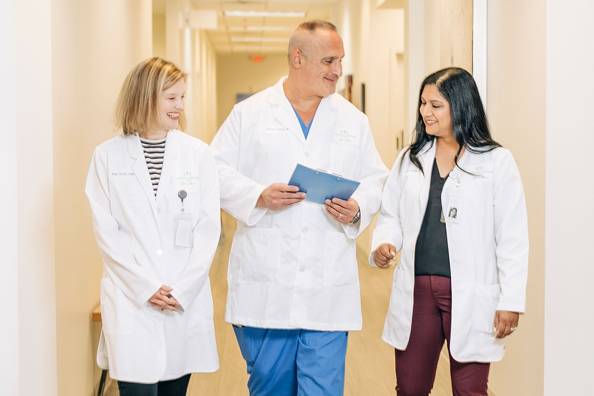 Physicians walking down a hallway