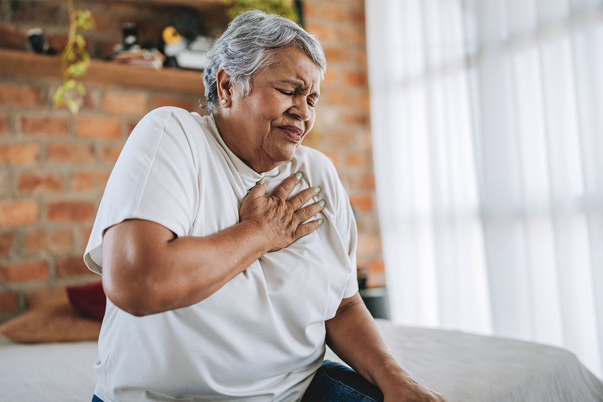 Older woman feeling pain in her chest