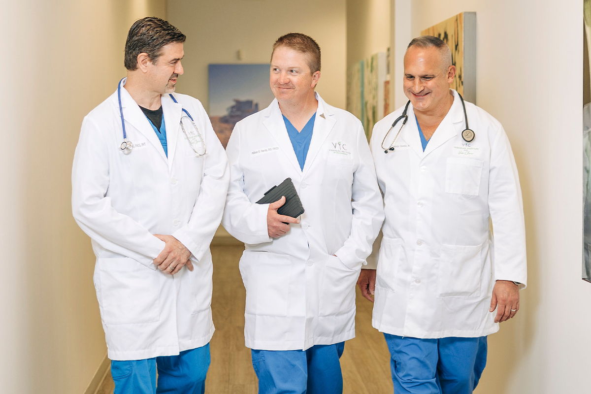 Physicians walking together in a hallway