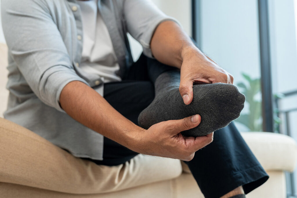 Man holding his foot