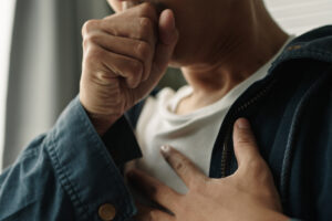 man coughing from long covd