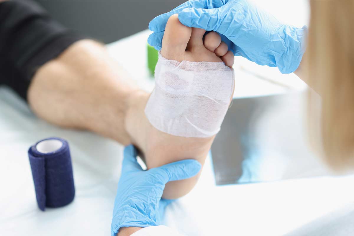 Physician inspecting person's foot
